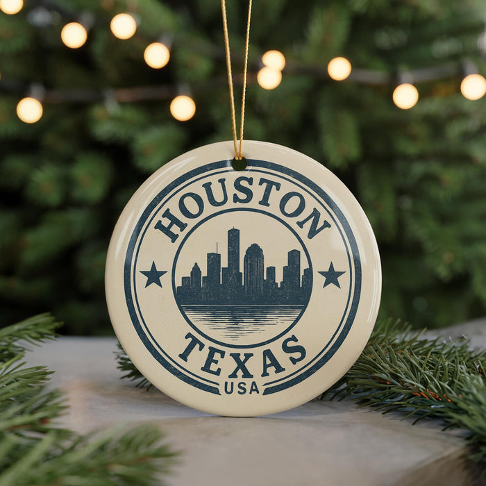 A circular ornament with the text "HOUSTON TEXAS USA" and a silhouette of a city skyline, hanging from a string.