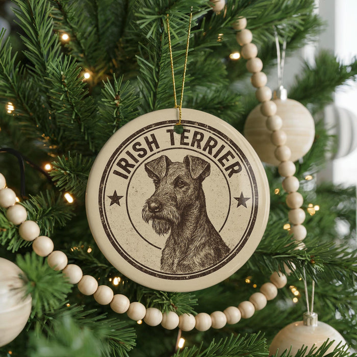A circular ornament on a Christmas tree featuring an illustration of an Irish Terrier dog.