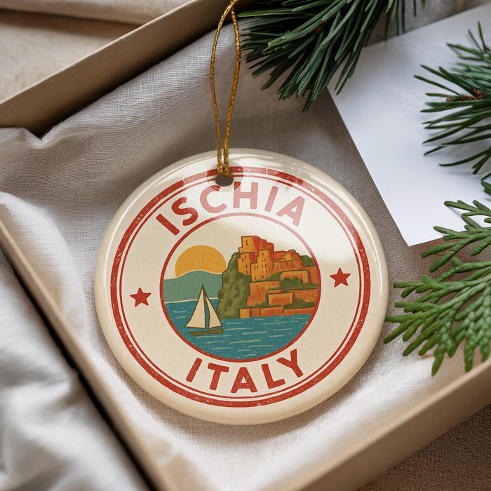 A circular ornament with the text "ISCHIA ITALY" and an illustration of a sailboat on a body of water, surrounded by greenery.