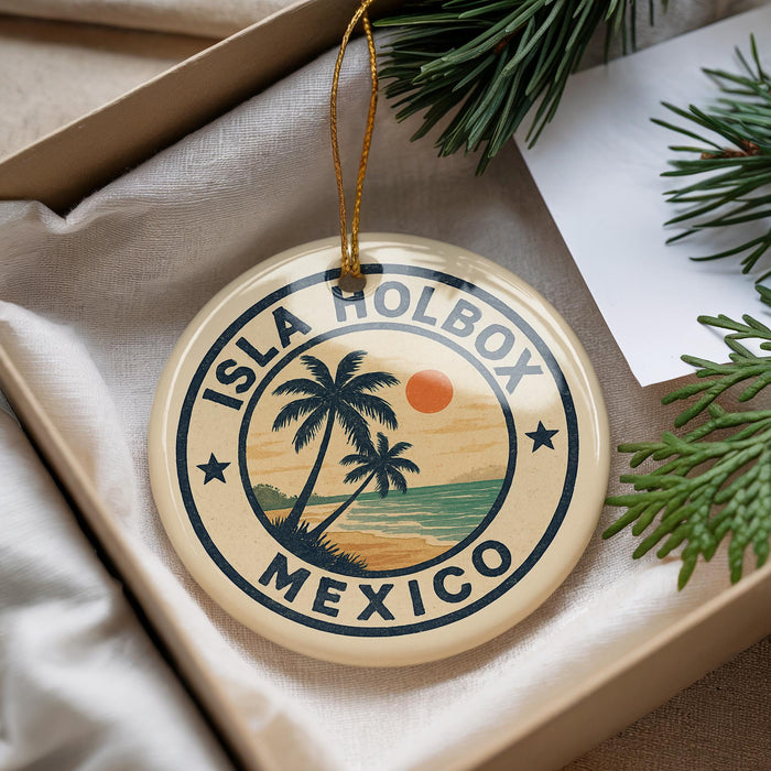 A circular ornament with the text "ISLA HOLBOX MEXICO" and a palm tree design, hanging from a string.