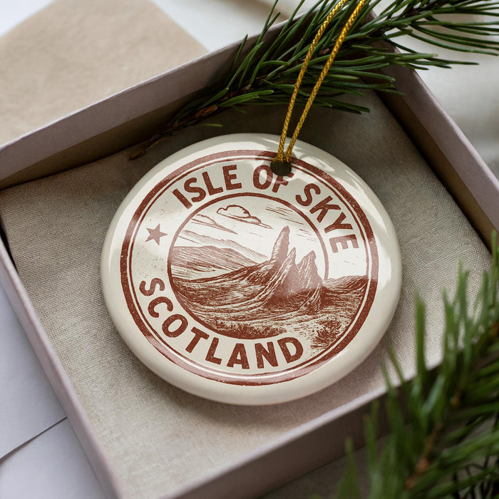 A circular ornament with the text "ISLE OF SKYE SCOTLAND" printed on it, surrounded by pine branches.