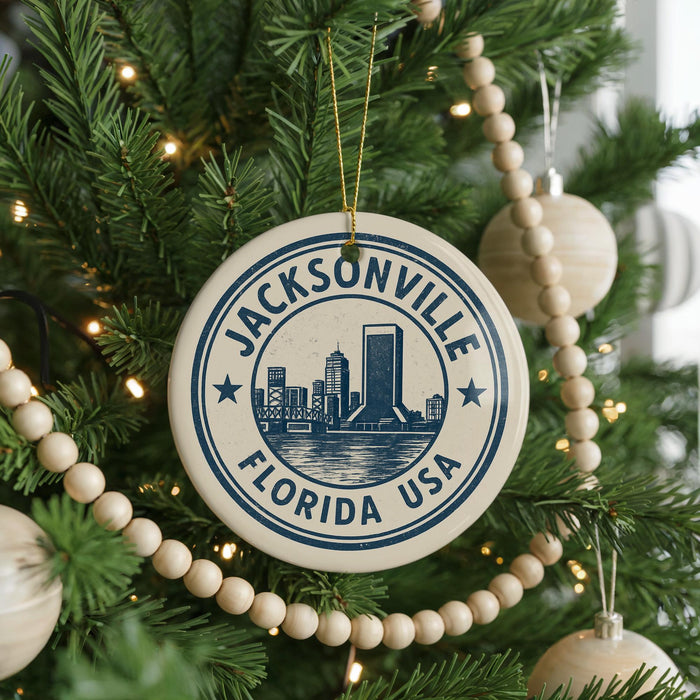 A Christmas tree decorated with ornaments, including a circular ornament with the text "JACKSONVILLE FLORIDA USA" and a cityscape design.