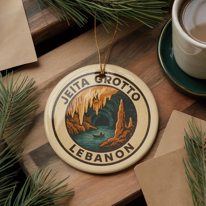 A circular ornament with the text "JEITA GROTTO LEBANON" and an illustration of a cave with a lake and a boat.