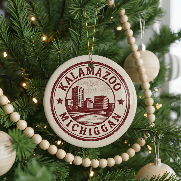 A Christmas tree decorated with ornaments, including a circular ornament with the text "KALAMAZOO, MICHIGAN" printed on it.