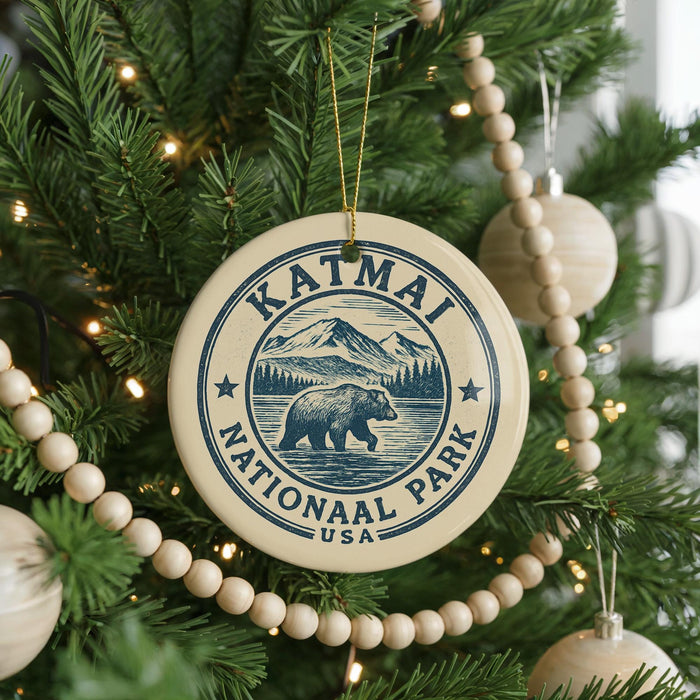 A Christmas tree decorated with ornaments, including a circular ornament with the text "KATMAI NATIONAL PARK USA" and a bear illustration.