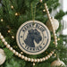 A circular ornament on a Christmas tree featuring a terrier dog's head and the text "Kerry Blue Terrier".