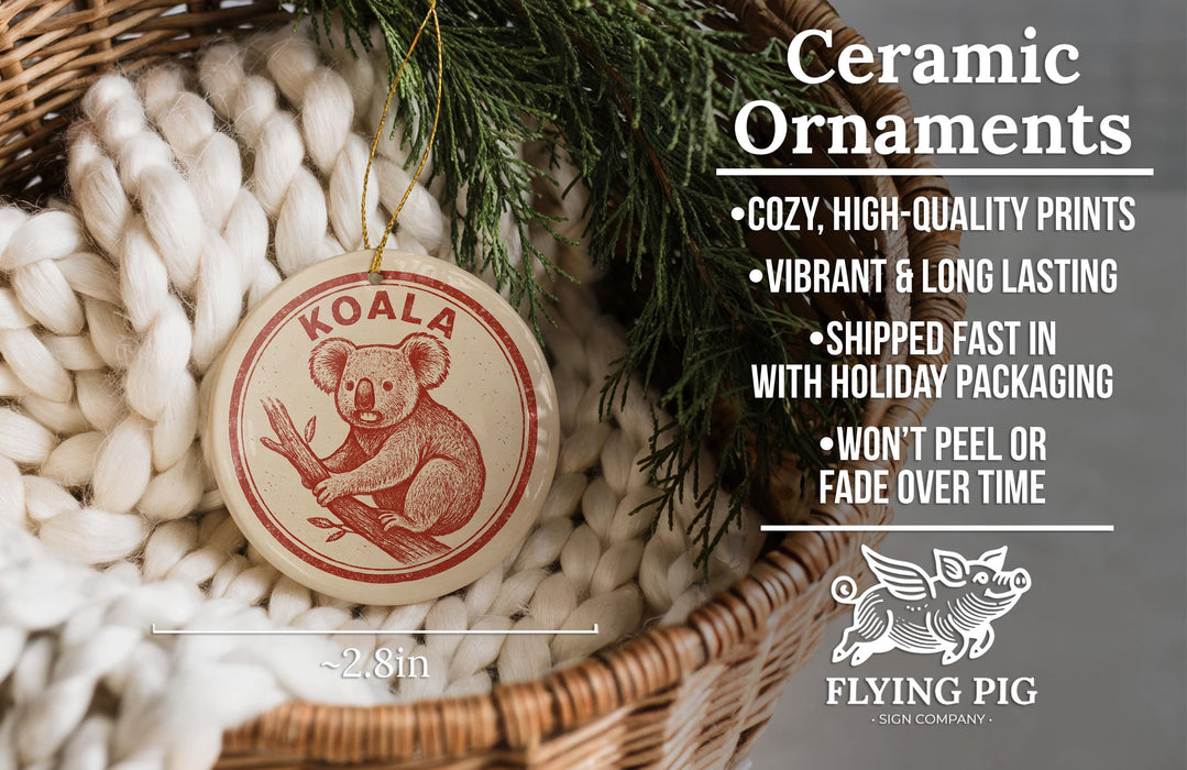 Ceramic ornaments, including a koala ornament, are displayed in a woven basket.