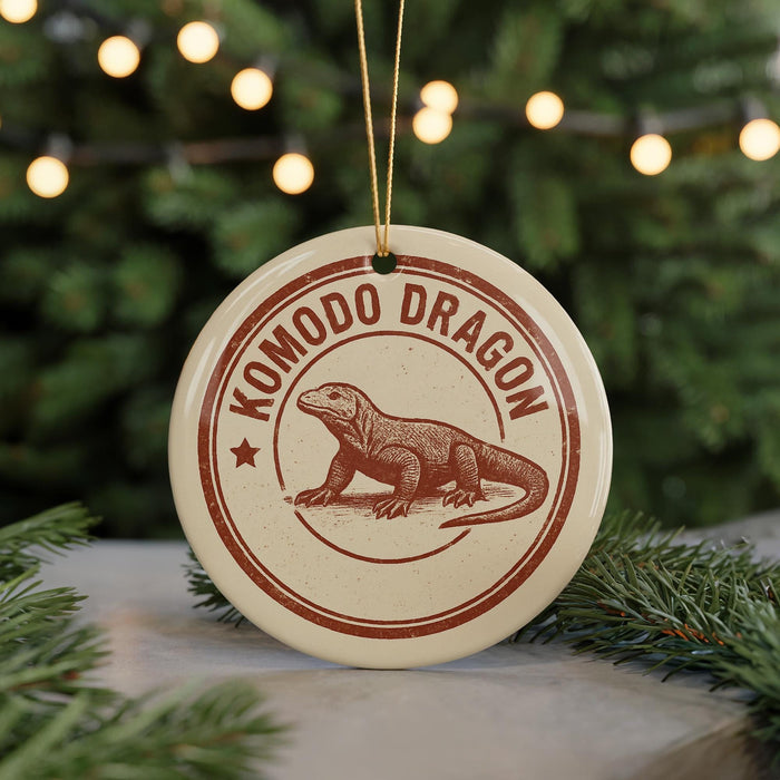 A circular ornament featuring a komodo dragon illustration, with the text "KOMODO DRAGON" printed on it.