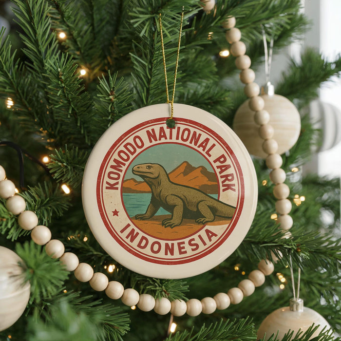 A circular ornament on a Christmas tree, featuring a komodo lope, a type of lizard, and the text "KOMODO NATIONAL PARK INDONESIA".