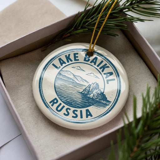 A circular ornament with the text "LAKE BAIKAL RUSSIA" printed on it, surrounded by pine branches.