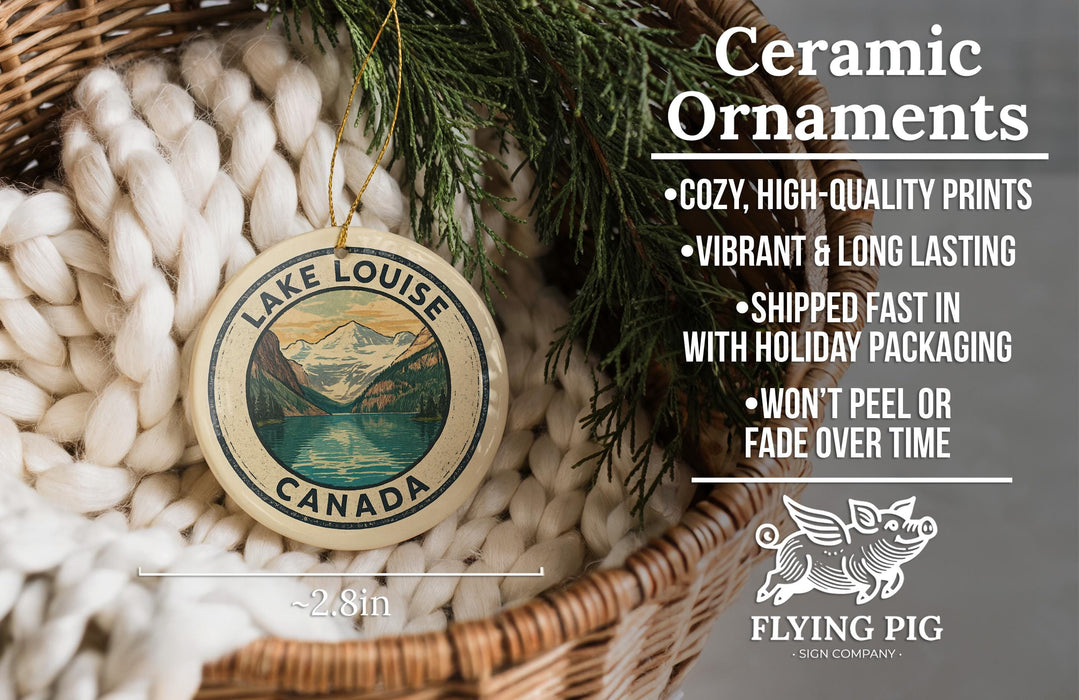 Ceramic ornaments, featuring a lake Louise Canada design, are displayed in a woven basket.