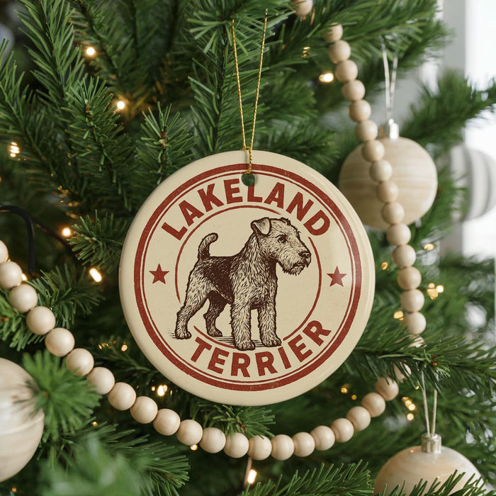 A circular ornament on a Christmas tree, featuring a terrier dog and the text "LAKELAND TERRIER".