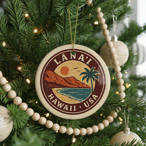 A circular ornament on a Christmas tree, featuring a palm tree and a sunset over the ocean, with the text "LÁNAI" and "HAWAII - USA" printed on it.