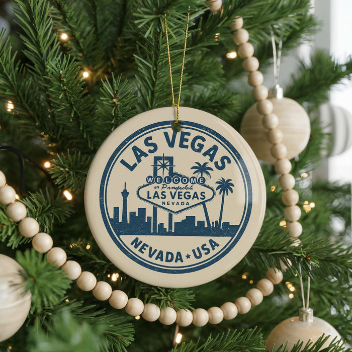A circular ornament on a Christmas tree, featuring the text "Las Vegas, Nevada, USA" and the Las Vegas skyline silhouette.
