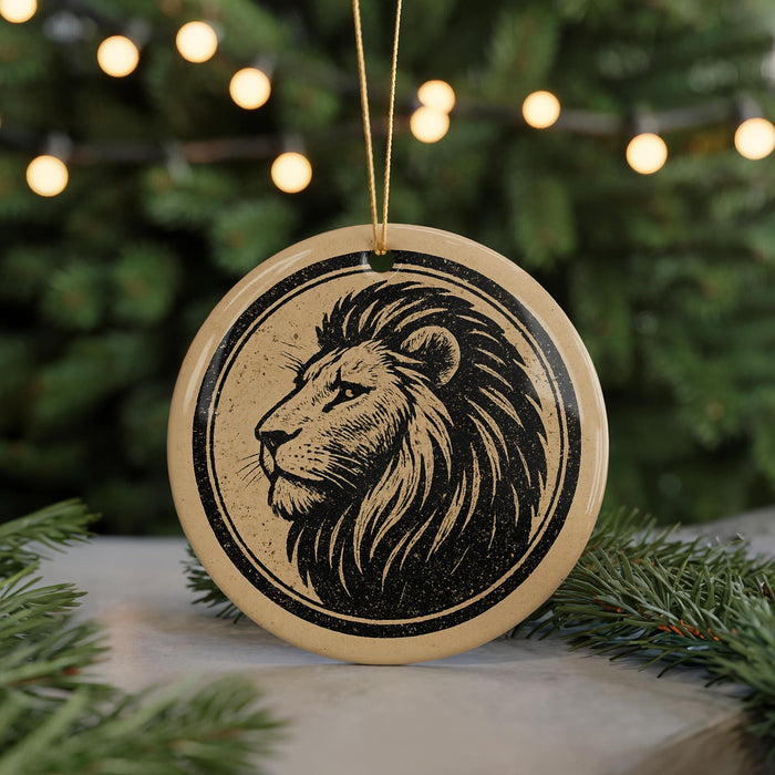 A circular ornament featuring a stylized lion's head design is displayed in front of a blurred background of Christmas lights.