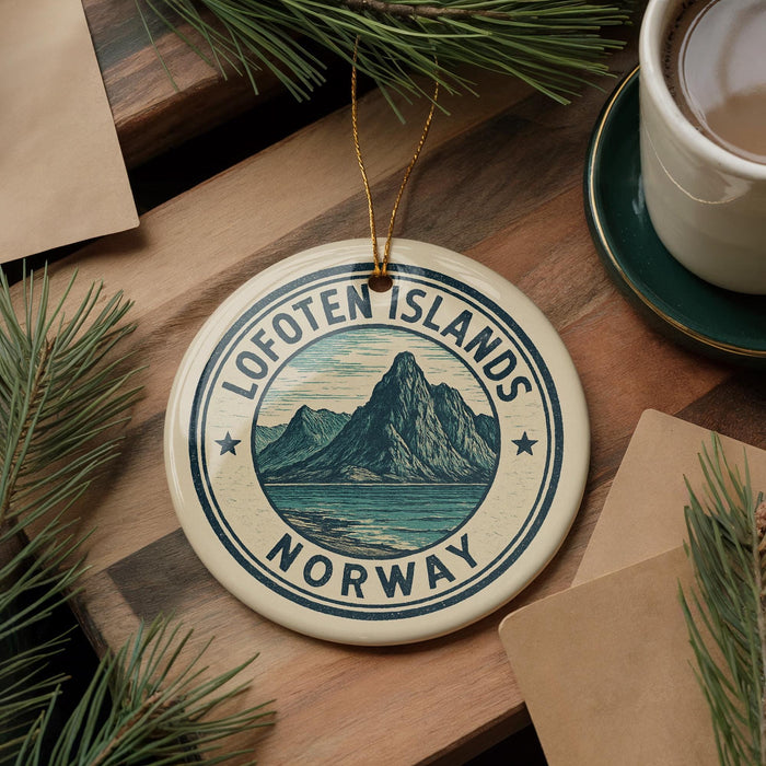 A circular ornament with the text "Lofoten Islands NORWAY" and a mountain landscape design, hanging on a wooden surface.