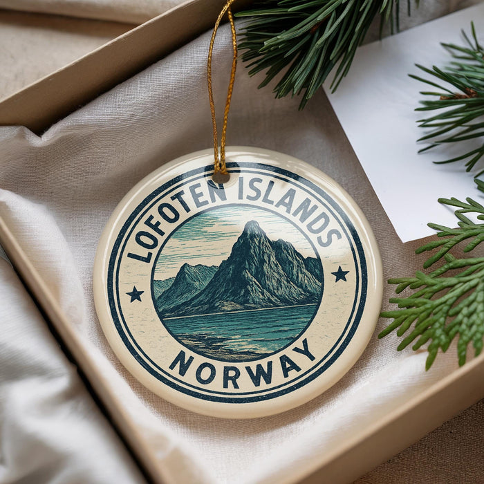 A circular ornament with the text "Lofoten Islands NORWAY" and a mountain landscape design, hanging from a string.