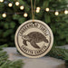 A circular ornament featuring a turtle design, with the text "Loggerhead Turtle" and "Caretta Caretta" printed on it.