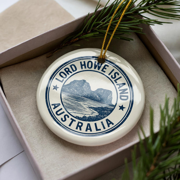 A circular ornament with the text "LORD HOWE ISLAND AUSTRALIA" printed on it, surrounded by pine branches.