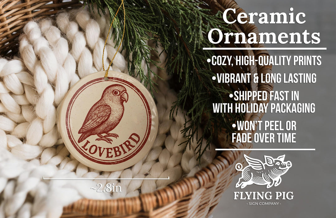 Ceramic ornaments, including a Lovebird ornament, are displayed in a woven basket.