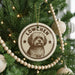 A circular ornament on a Christmas tree featuring a dog's face and the text "LOWchen".