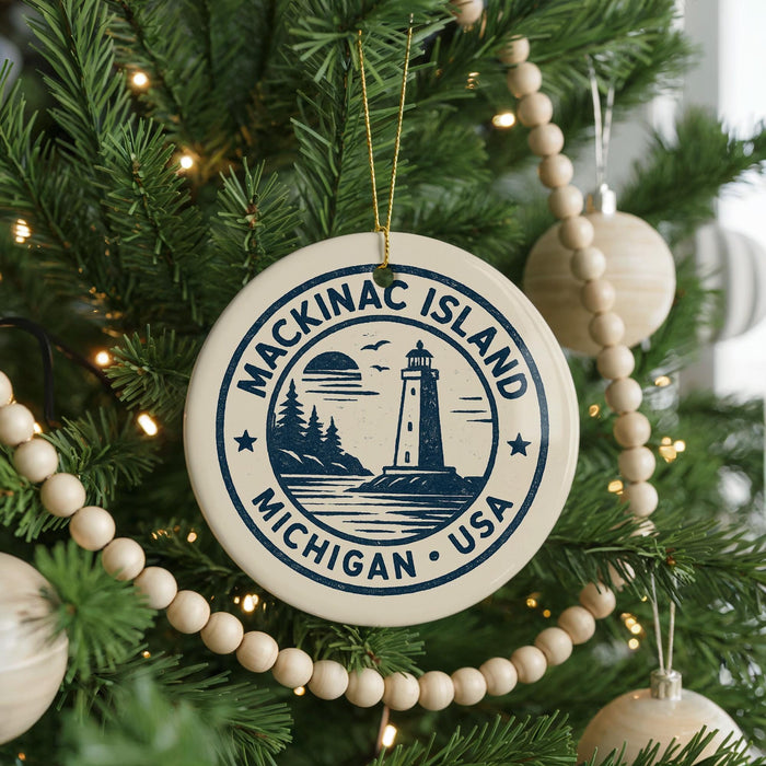 A Christmas tree decorated with ornaments, including a circular ornament with the text "Mackinac Island, Michigan, USA" and a lighthouse image.