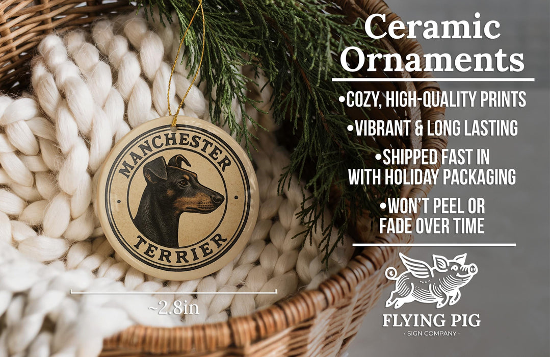 Ceramic ornaments, specifically a Manchester Terrier ornament, are displayed in a wicker basket. The ornament features a black and brown dog's head and the text "MANCHESTER TERRIER". The image also includes text describing the ornament's features, such as being cozy, high-quality, vibrant, and long-lasting, and being shipped fast in holiday packaging. The image also mentions that the ornament won't peel or fade over time.