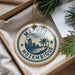A circular ornament with the text "Mazuto Mozambique" printed on it, hanging from a string.