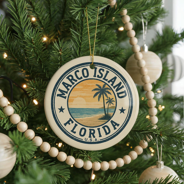 A Christmas tree decorated with ornaments, including a circular ornament with the text "MARCO ISLAND FLORIDA" and a palm tree design.