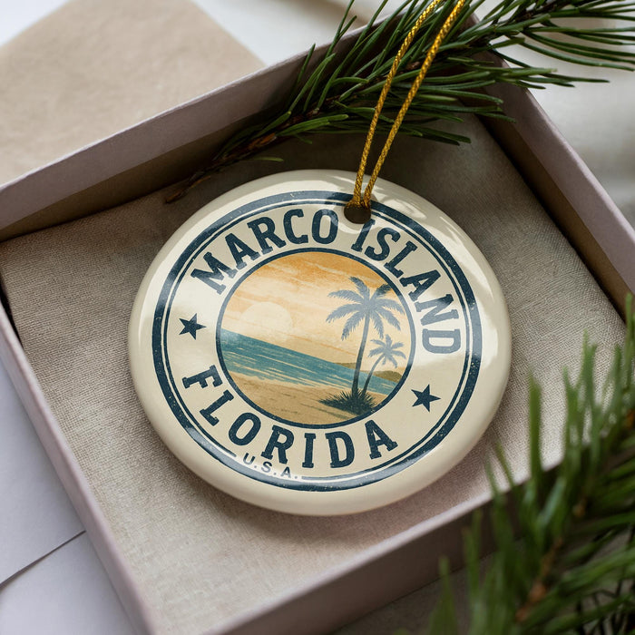 A circular ornament with the text "MARCO ISLAND FLORIDA" printed on it, surrounded by a palm tree and beach scene.