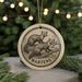 A circular ornament featuring a woodchuck illustration, with the word "MARTENS" written around the edge.