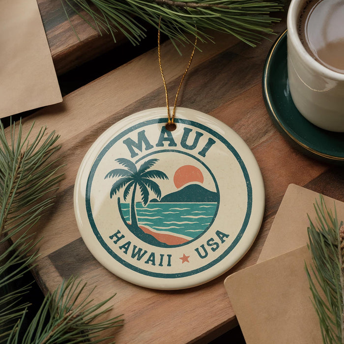 A circular ornament with the text "MAUI HAWAII USA" and a palm tree design, hanging on a wooden surface.