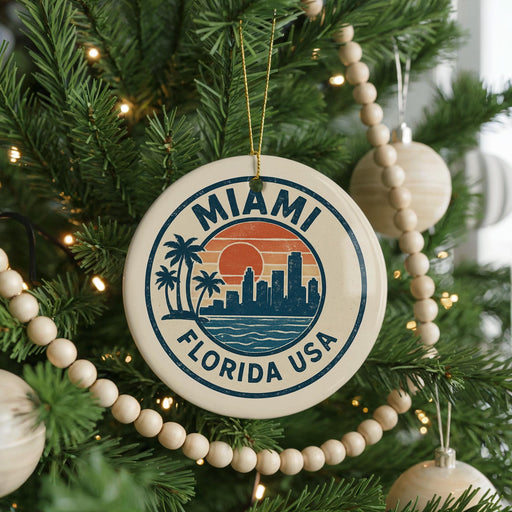 A round ornament on a Christmas tree with the text "MIAMI FLORIDA USA" and a graphic of a city skyline with palm trees.