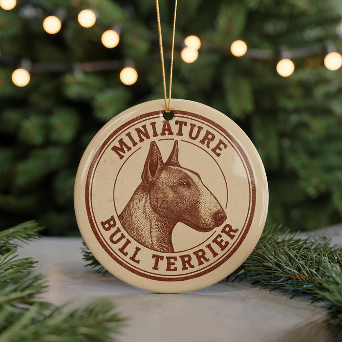 A round ornament featuring a bull terrier dog's head, with the text "MINIATURE BULL TERRIER" printed on it.