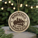 A circular ornament with the text "MINNEAPOLIS USA" and a graphic of a city skyline, hanging from a string.
