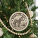 A Christmas tree decorated with a circular ornament featuring a zebra and the text "MOUNTAIN ZEBRA".