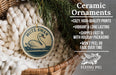 Ceramic ornaments, featuring a ceramic swan ornament with a wicker basket and pine branches, are displayed on a bed of white yarn.