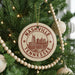 A Christmas tree decorated with ornaments, including a circular ornament with the text "Nashville, Tennessee" and a cityscape illustration.