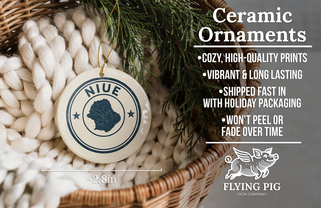 Ceramic ornaments, featuring a white ceramic ornament with a blue design and text, are displayed in a wicker basket.