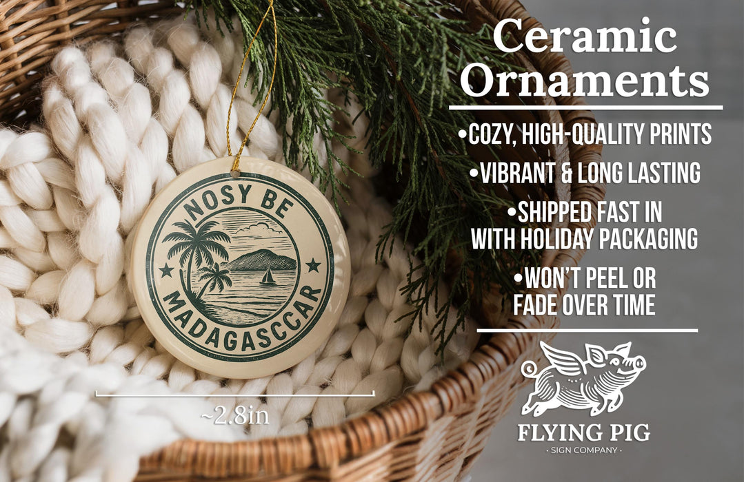 a ceramic ornament hanging from a wicker basket, with a pine branch and greenery in the background.