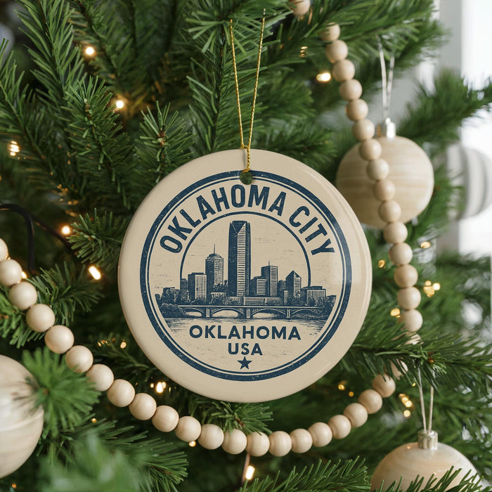 A circular ornament on a Christmas tree, featuring the text "OKLAHOMA CITY USA" and an illustration of the city skyline.