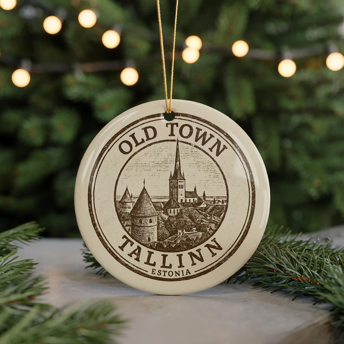 A circular ornament with the text "OLD TOWN TALLINN ESTONIA" printed on it, featuring an illustration of a cityscape.