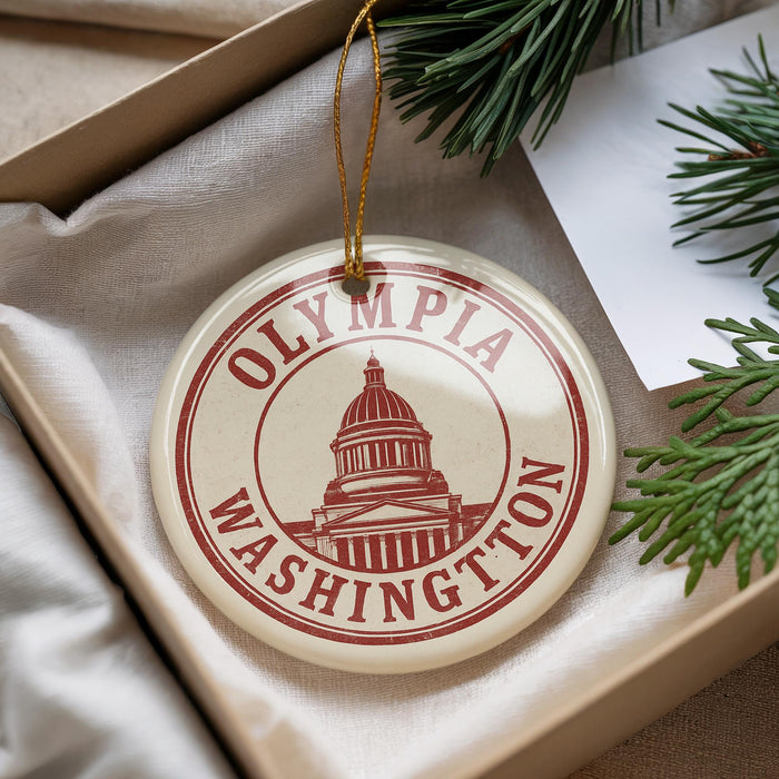 A round ornament with the text "OLYMPIA WASHINGTON" and a graphic of the Washington State Capitol building.