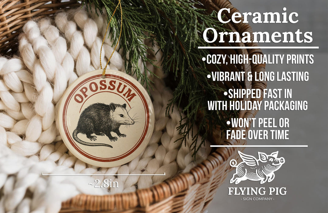 Ceramic ornaments, featuring a ceramic ornament with an image of an opossum, are displayed in a wicker basket.