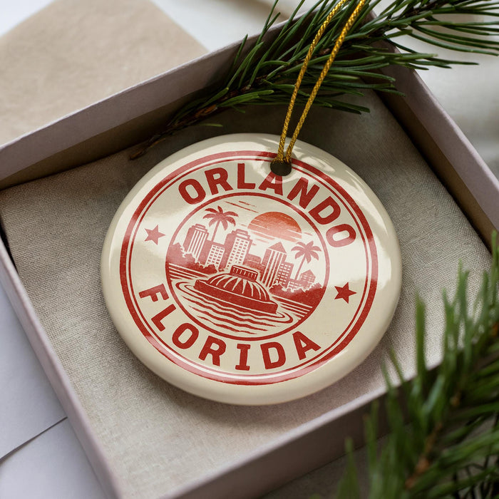 A circular ornament with the text "ORLANDO FLORIDA" printed on it, surrounded by a decorative border and a palm tree design.