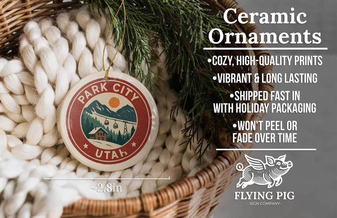 Ceramic ornaments, including a Park City Utah ornament, are displayed in a woven basket.