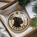 A decorative ornament featuring a black and white illustration of a terrier dog, with the text "PATTERDALE TERRIER" printed on it.