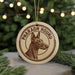 A circular ornament featuring a close-up of a dog's head, with the text "PHARAOCH HOUND" printed on it.
