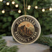 A circular ornament with the text "PINNACLES NATIONAL PARK" and an illustration of mountains, hanging from a string.