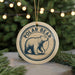 A circular ornament featuring a polar bear illustration, with the text "POLAR BEAR" prominently displayed.